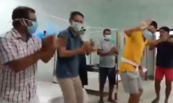  Coronavirus Patients, Assam, Quarantine Centre,playing Flute,group Of Men  Dance-TeluguStop.com