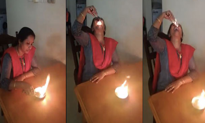  Woman Swallows Fire Viral Video, Fire Balls, Woman Eating Fire, Viral Video, Net-TeluguStop.com