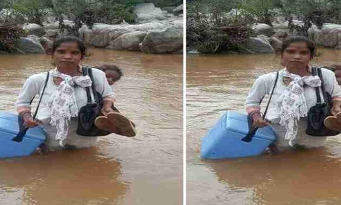  Medicine Can In One Hand A Woman Carrying A Baby On Her Back Crossing The River-TeluguStop.com