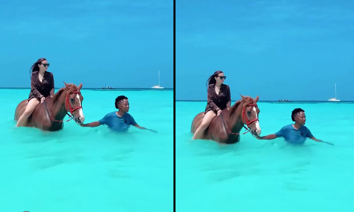  A Young Woman Riding A Horse In The Water Water, Viral News, Viral Latest, Socia-TeluguStop.com