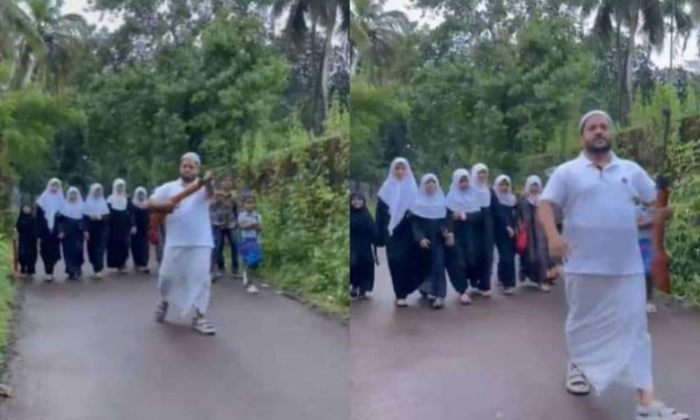  Kerala Man With Air Gun Escorts Kids To Madrasa,kerala, School Children,dogs Att-TeluguStop.com