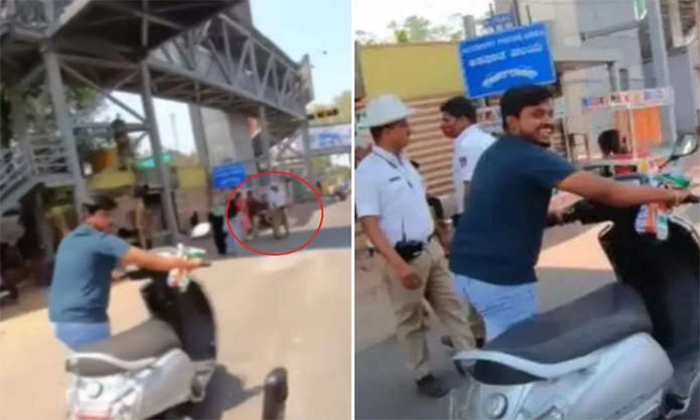  Man Without Helmet Escapes Traffic Police With This Trick Video Viral Details, H-TeluguStop.com