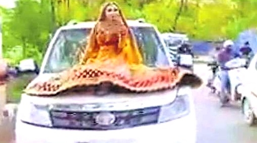 Bride Rides On Car Bonnet, Gets Fined By Up Cops Bride Rides On Car Bonnet, Gets Fined By Up Cops-TeluguStop.com