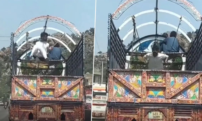  Video Of A Man Enjoying Swinging Inside Moving Truck Viral Details, Swing, Lorry-TeluguStop.com