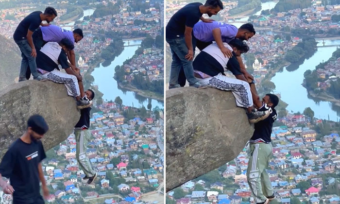  Viral Video: This Is Friendship Ra Babu A Friend Hanging On A Rock Finally , Vi-TeluguStop.com