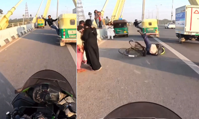  Stunts Of A Young Man In A Running Auto.. Brought Another's Life! Running Autio,-TeluguStop.com