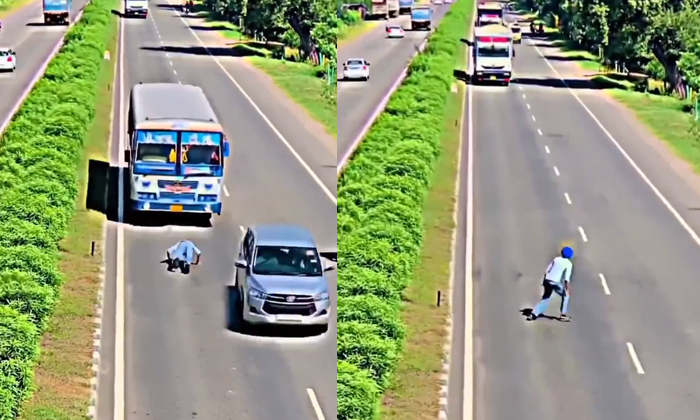  Man Dangerous Stunt While Crossing The Road Video Viral Details, Viral Video, Ro-TeluguStop.com