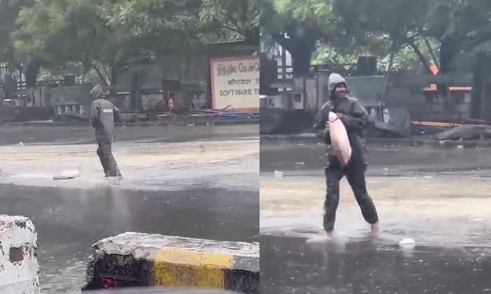  Man Fishing On The Road After Michaung Cyclone In Chennai Details, Cyclone Micha-TeluguStop.com