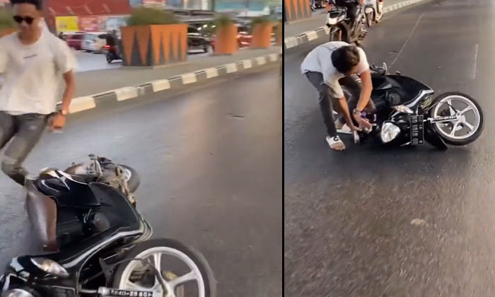 Viral Video Risky Stunts On Busy Road Scooter Skids , Viral Video, Latest Ne Viral Video Risky Stunts On Busy Road Scooter Skids , Viral Video, Latest Ne-TeluguStop.com