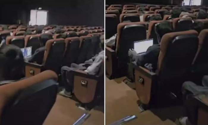  Man Works On A Laptop In Movie Hall In Bengaluru Video Viral Details, Viral Vide-TeluguStop.com