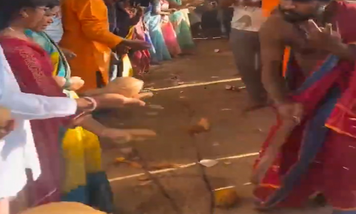  Priest Breaking Coconut With Iron Rod Viral Video,man , Breaking, Cocount, Viral-TeluguStop.com