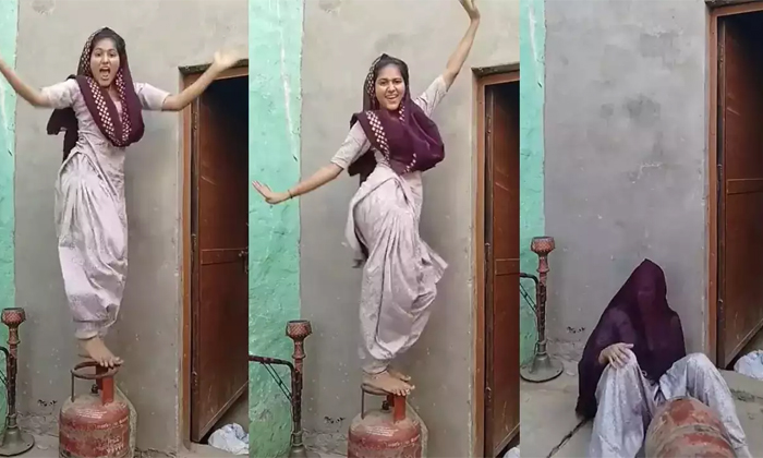  Viral Video Girl Dancing On Gas Cylinder Suddenly Falls Down Details, Viral Vide-TeluguStop.com