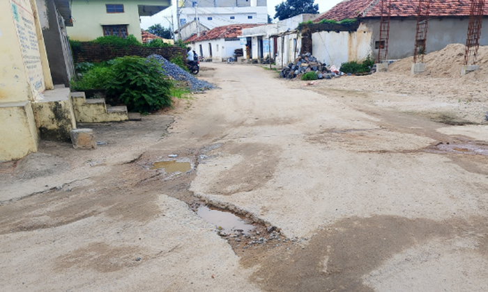  Cc Road Is Full Of Potholes, Cc Road , Potholes, Cc Road Damaged, Rajanna Sircil-TeluguStop.com