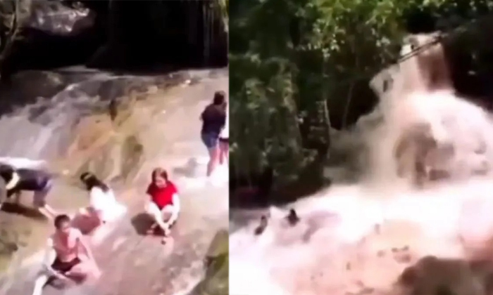  Video Captures Deadly Monsoon Surge Tourists Swept Off By Rising Waterfall Video-TeluguStop.com