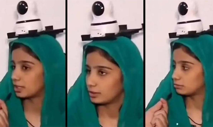  A Pakistani Father Has Mounted A Cctv Camera On His Daughters Head Viral Video D-TeluguStop.com