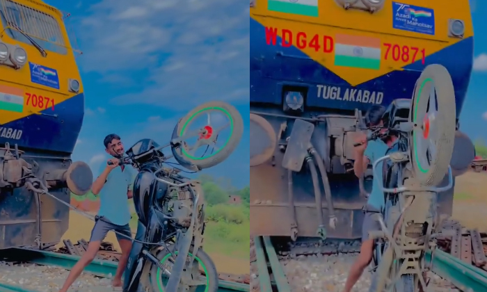  Man Pulls Locomotive With His Bike Viral Video Details, Social Media, Viral Vide-TeluguStop.com