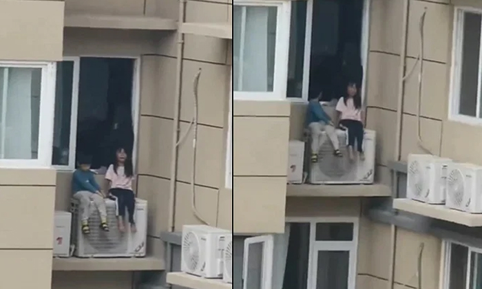  Chinese Woman Risks Children Lives On Ac Unit To Upset Husband During Argument V-TeluguStop.com