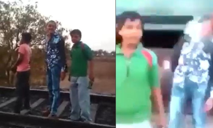  This Is A Pitiyam Ra Babu Standing In Front Of A Moving Train Doing Reels, Socia-TeluguStop.com