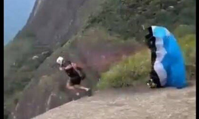  The Video Of The Sky Diving Instructor Who Fell Down From The Cliff Went Viral,-TeluguStop.com