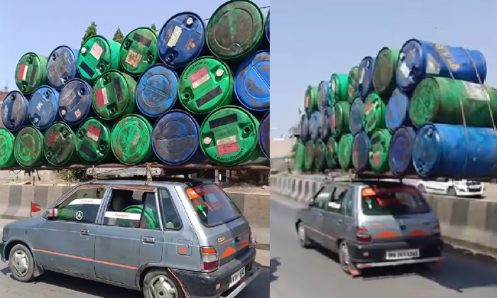  Two Dozens Plastic Drums Being Tied Carried Roof Of A Maruti-800 Car Video Vrial-TeluguStop.com