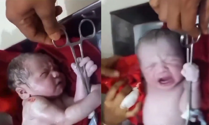  A New Born Baby Hold Scissors Tightly Funny Video Viral Details, Newborn Baby, S-TeluguStop.com